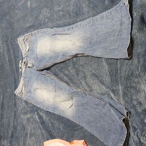 Distressed boot cut jeans